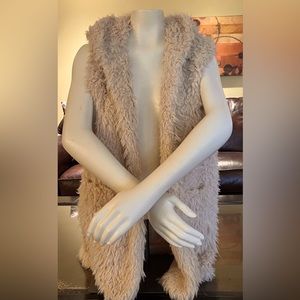 A beautiful crème angora fur hooded vest